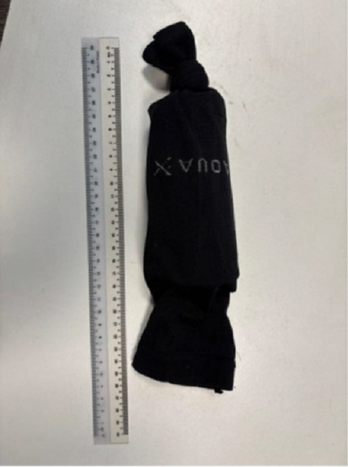 Tube used to transport the White-rumped shama wrapped in the black cloth
